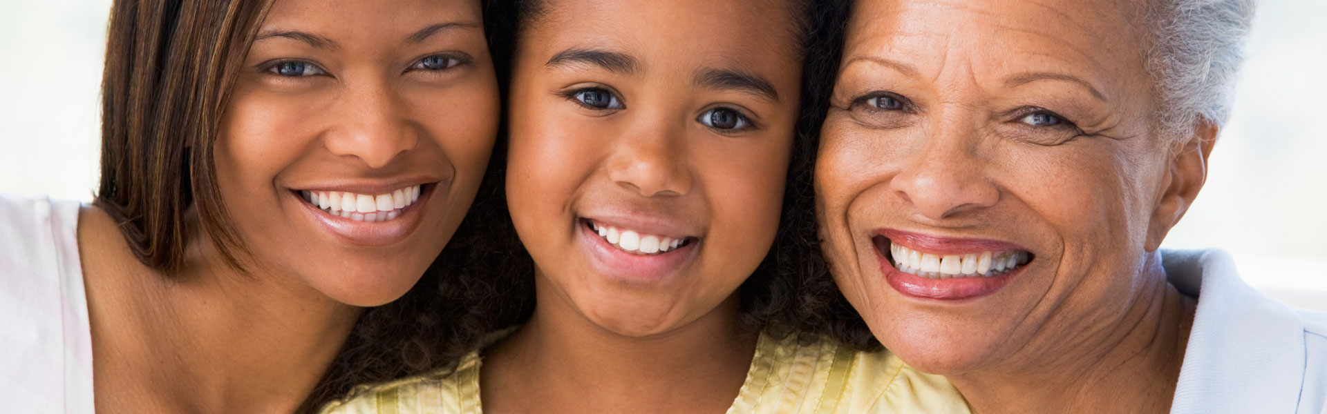 Grandmother with adult daughter and grandchild