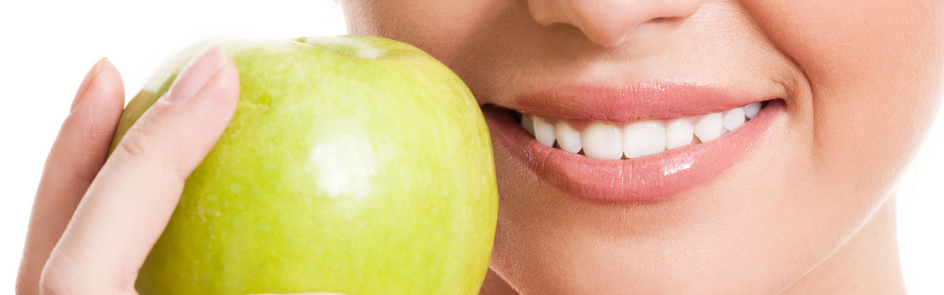 A woman holding an apple