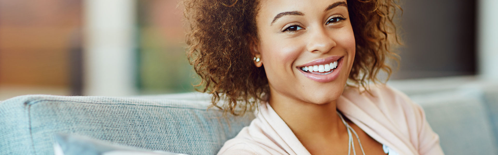 Happy woman after having root canals treatment