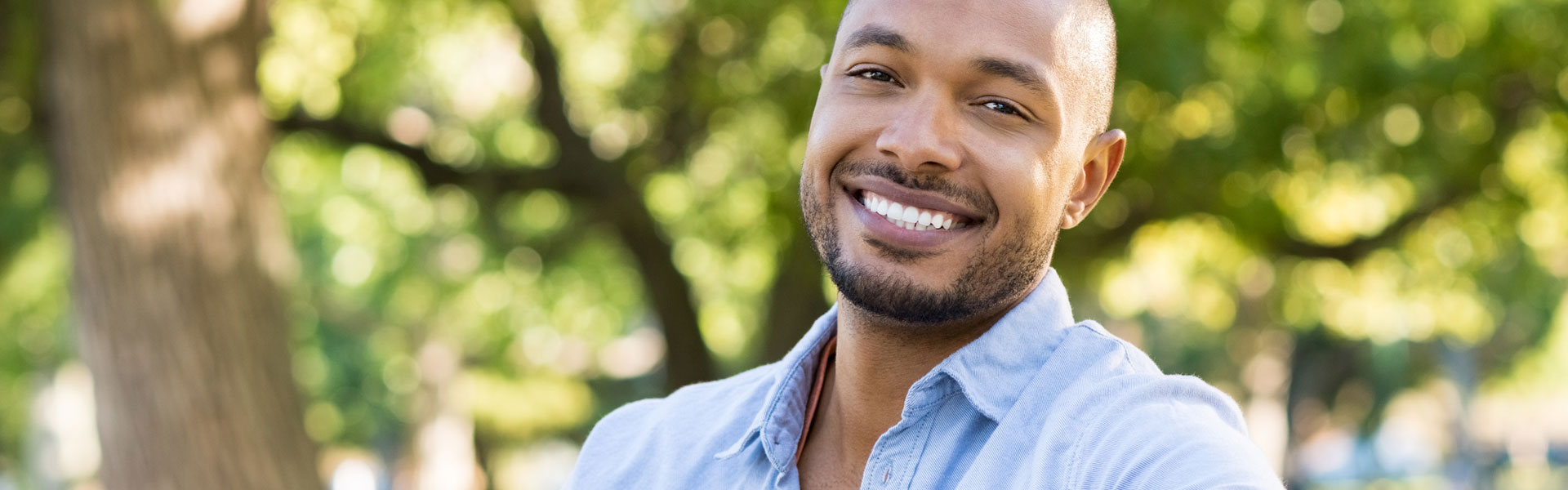 Smiling man after having dental crowns